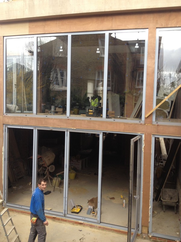 Aluminium bi-fold doors with two-storey glazing in Maida Vale
