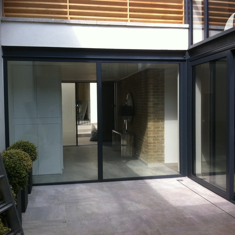 Floor-to-ceiling sliding doors opening to courtyard in Maida Vale