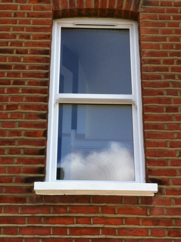 uPVC sash window on Victorian red brick house in Maida Vale